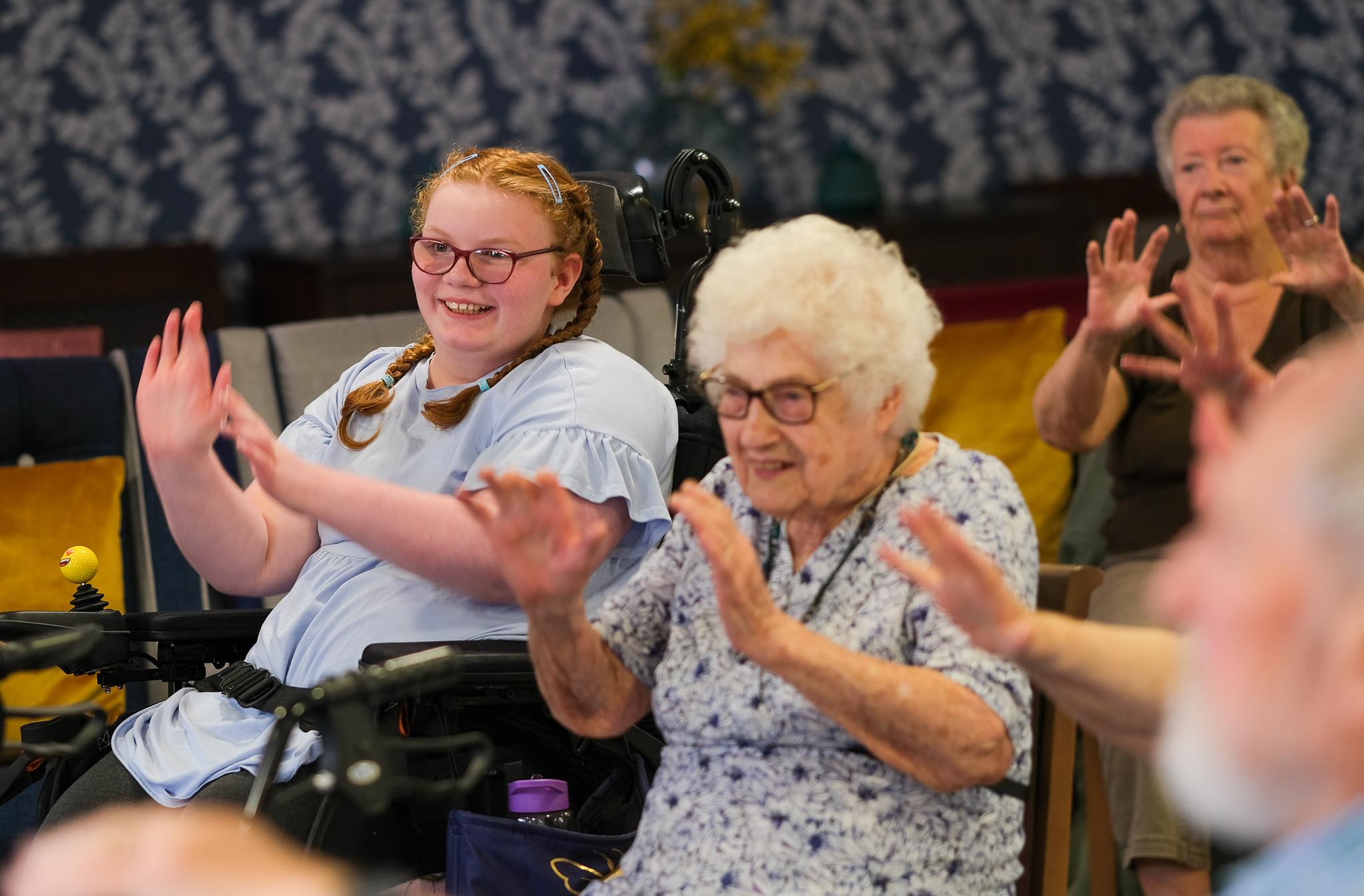 People enjoying a limited-mobility exercise class