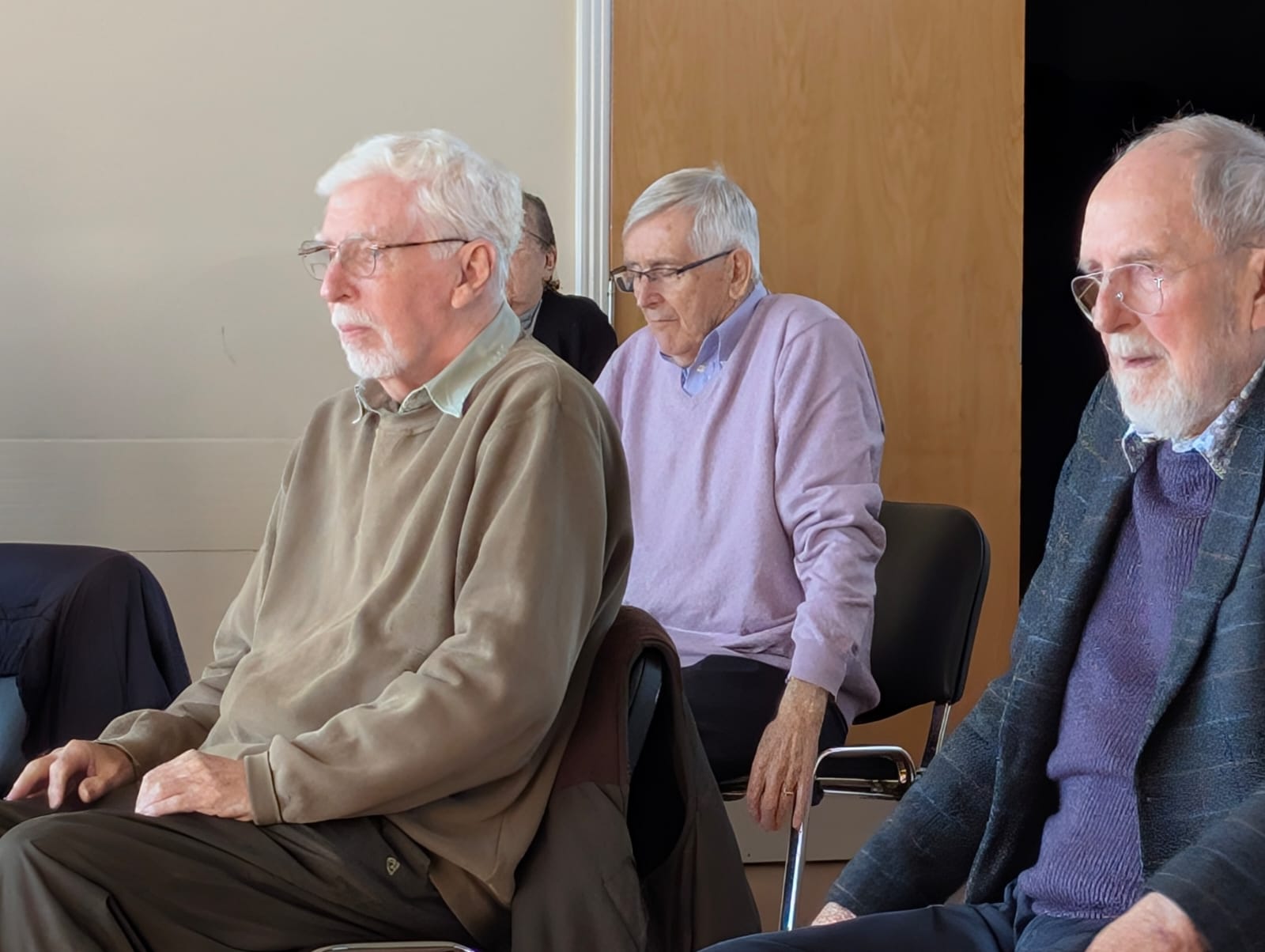 men doing seated chair exercises