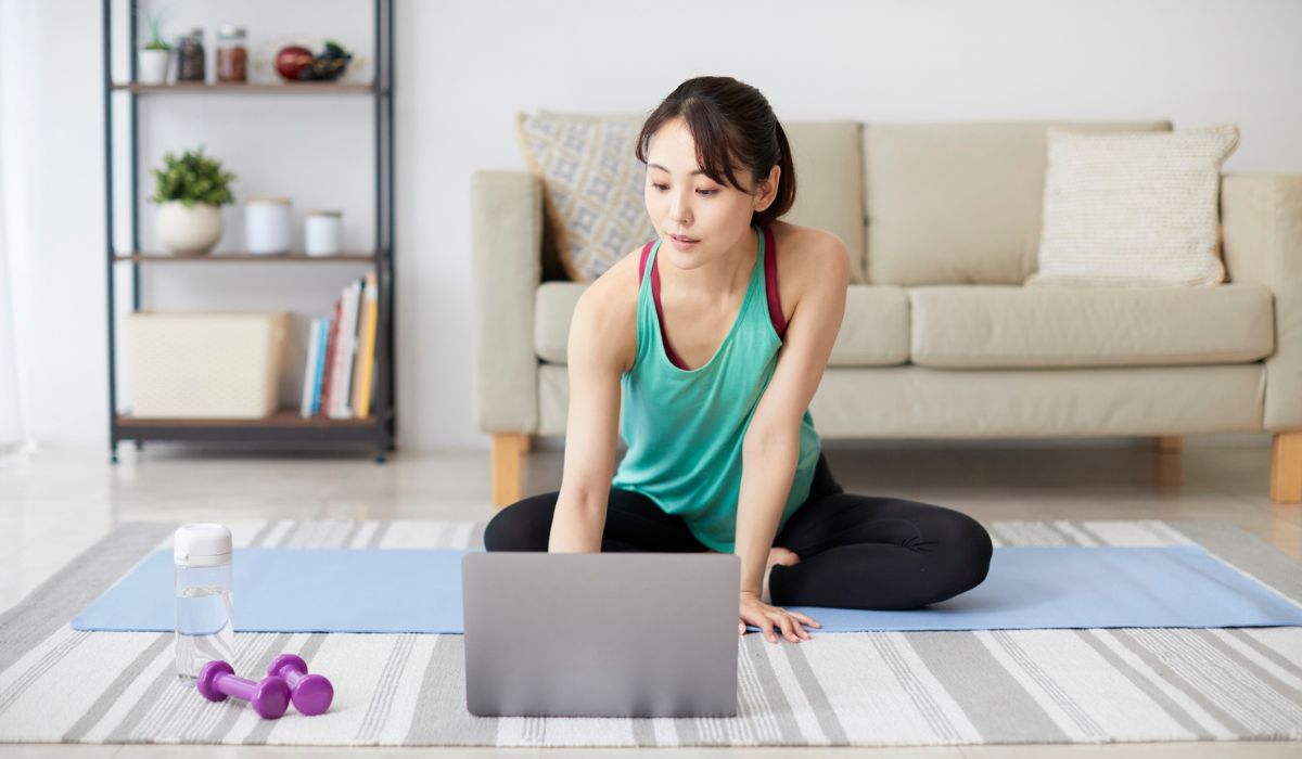 Woman doing some online exercise at home