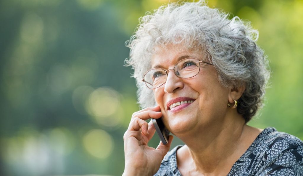 Older person walking whilst on the phone to increase movement