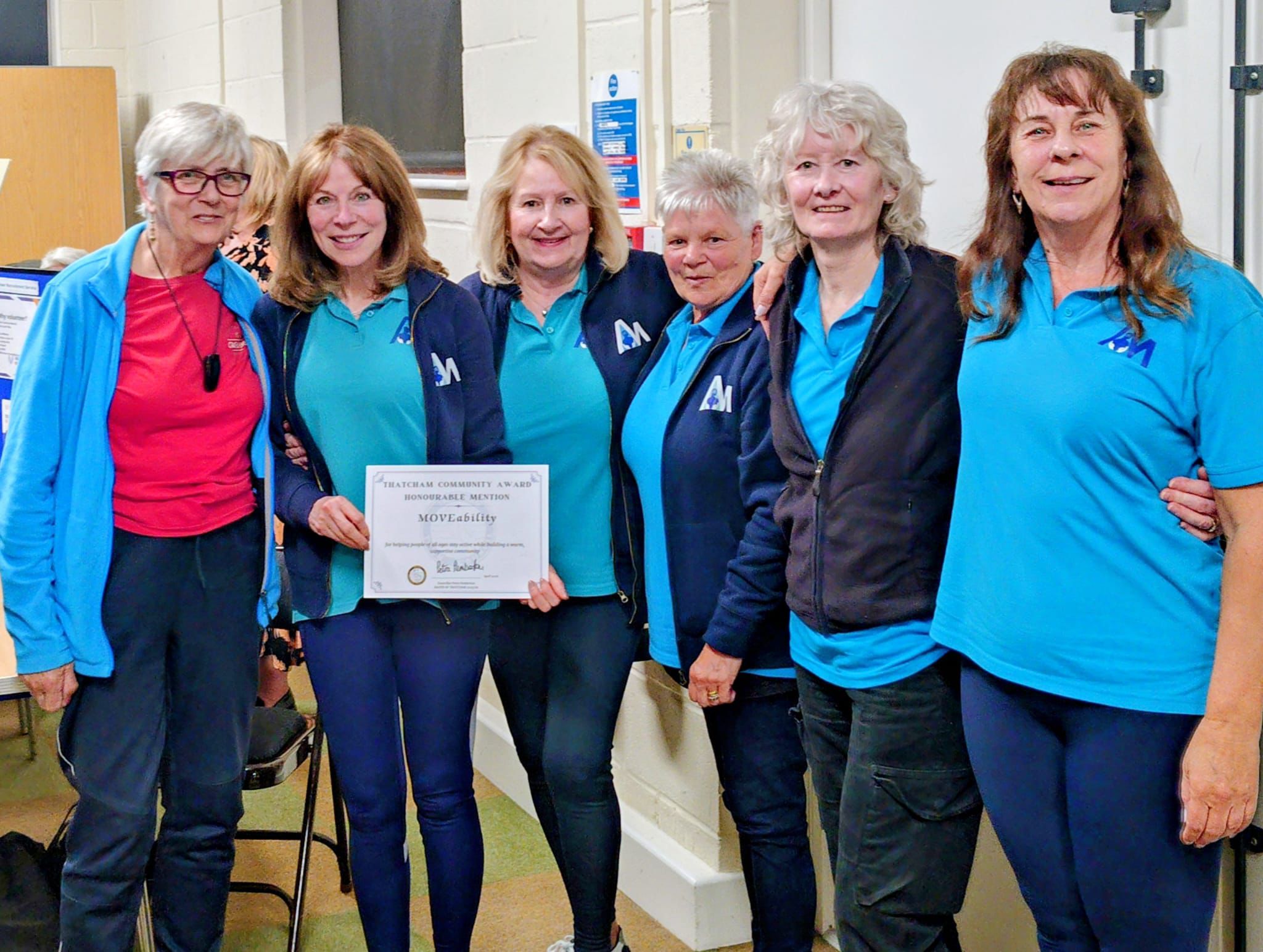The MOVEability team receiving a Thatcham Community Award