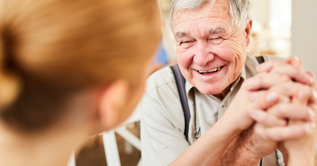Senior man being supported by carer